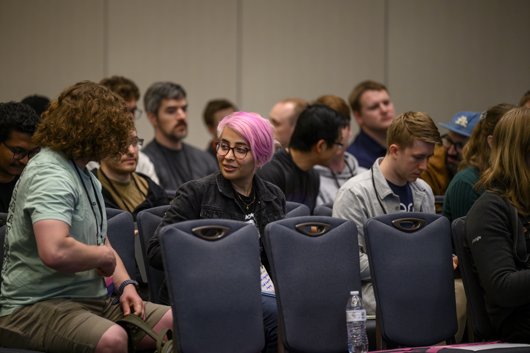 Attendees chatting in their seats between talks